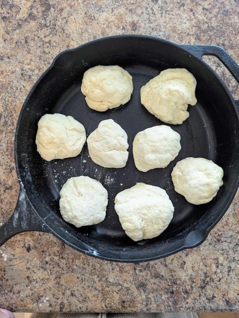 uncooked sourdough buttermilk biscuit doigh in a cast iron skillet