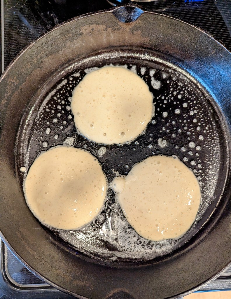 Sourdough cottage cheese pancakes before flipping