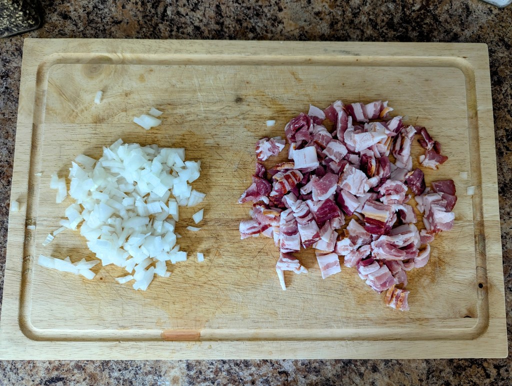 chopping bacon and onion on a wooden cutting board for easy high-protein quiche