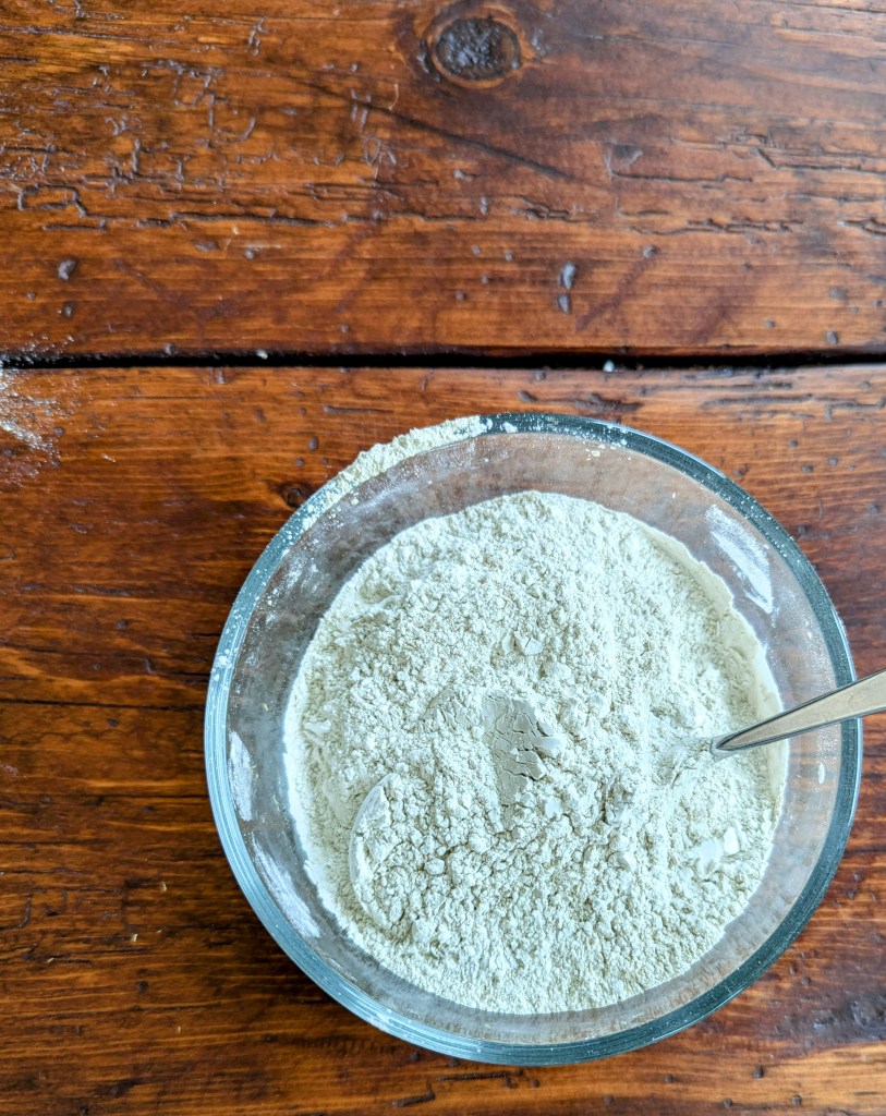 Step-by-step process of making homemade baby powder in a bowl