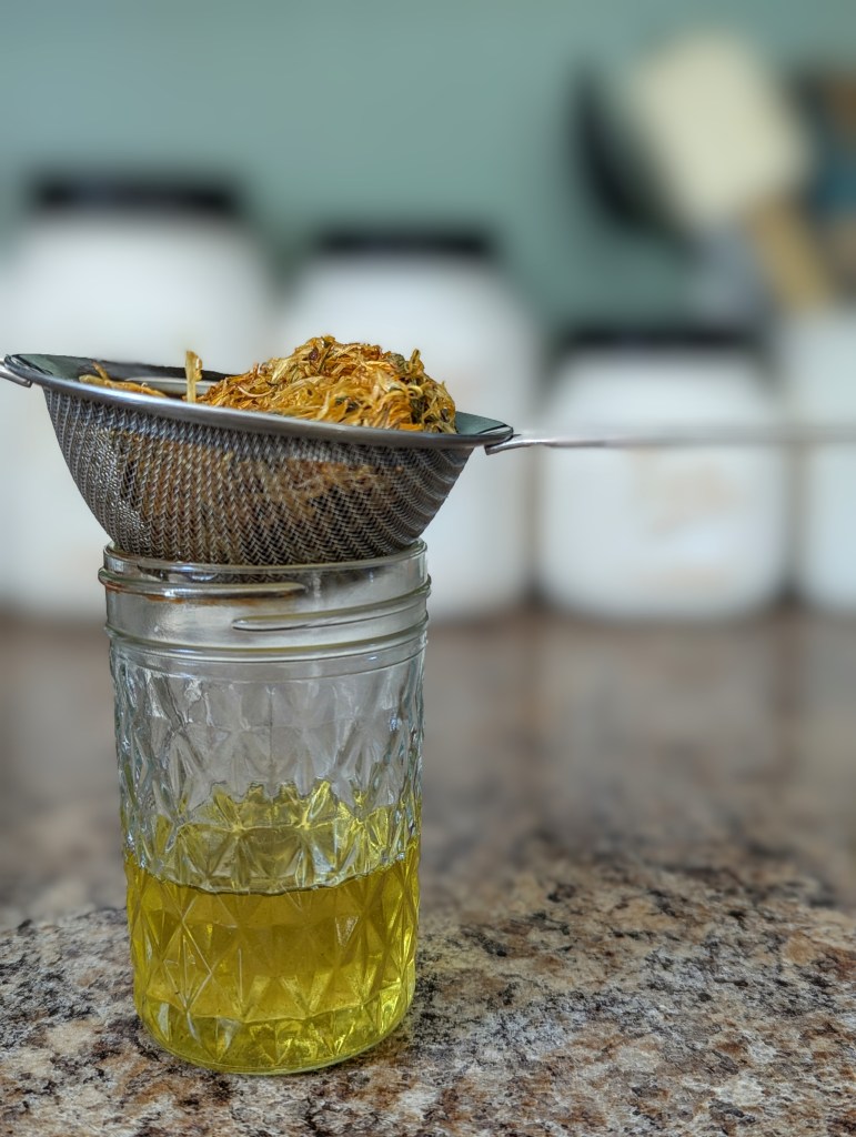 Calendula oil with coconut oil in a glass mason jar