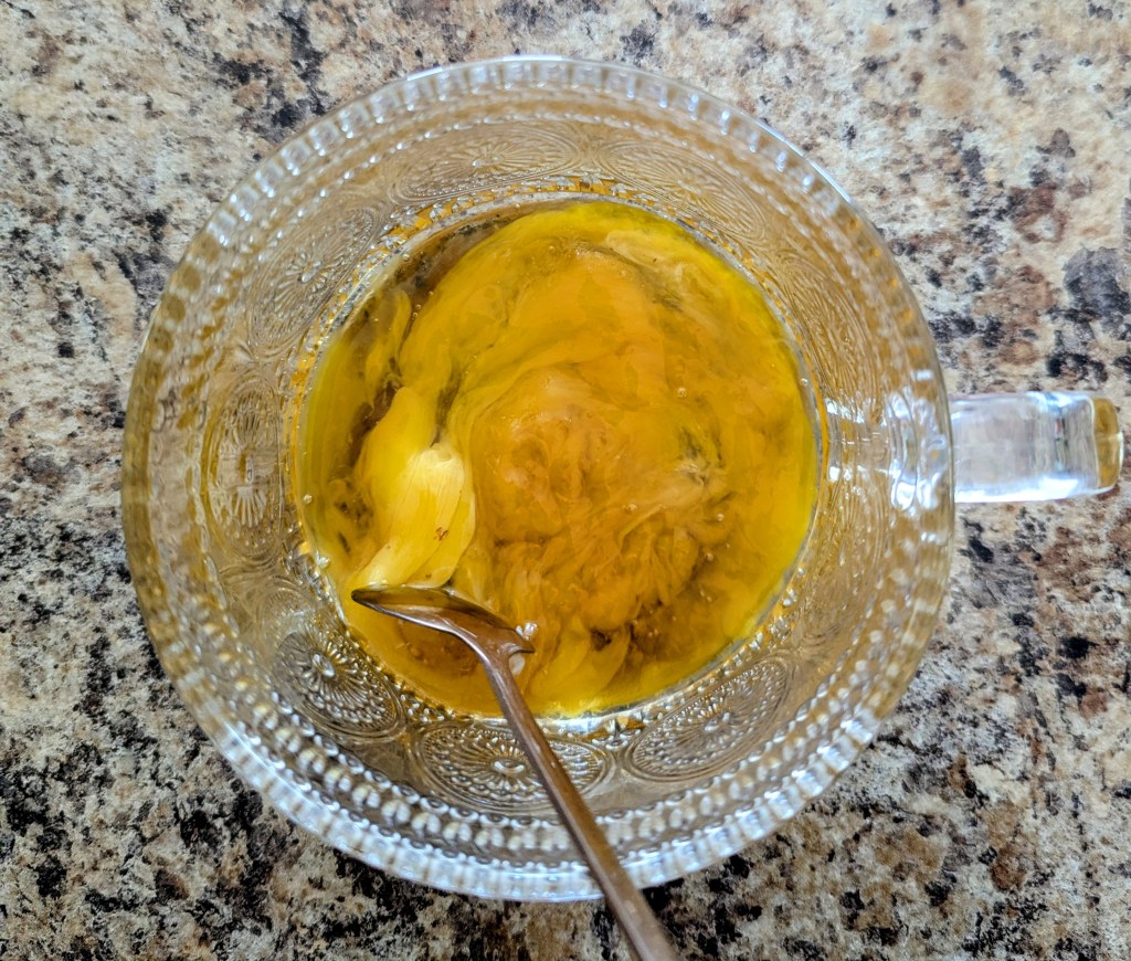 Stirring egg yolk and maply syrup for an egg yolk coffee