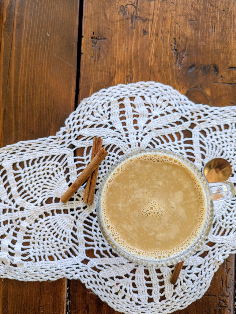Healthy latte with egg yolk on farmhouse table