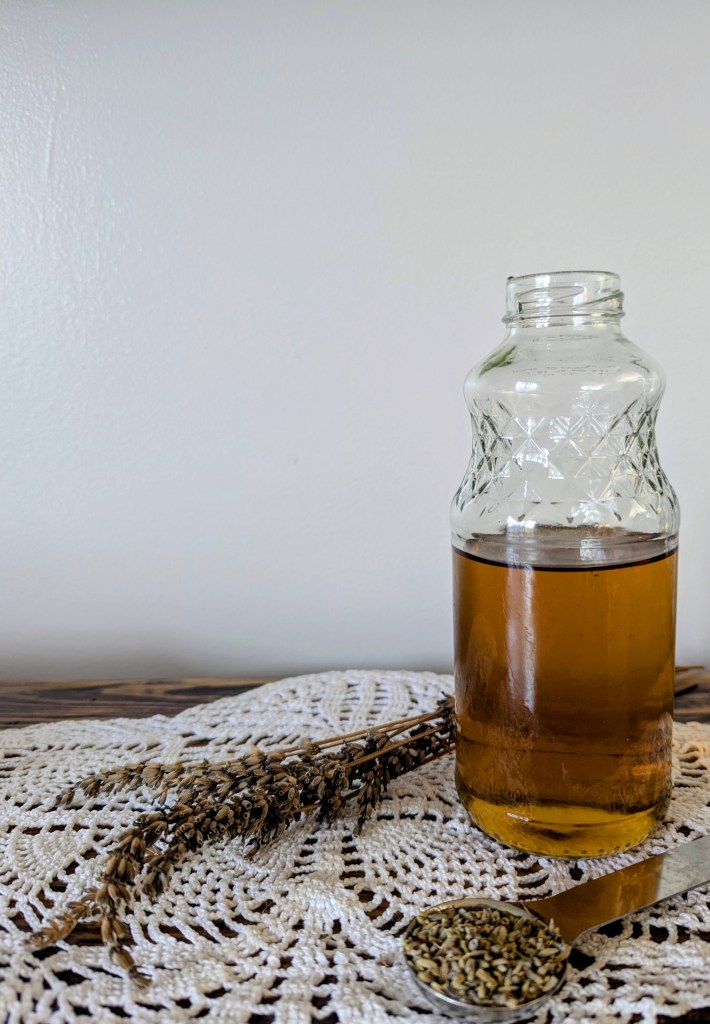 Simple syrup recipe with dried lavender on farmhouse table