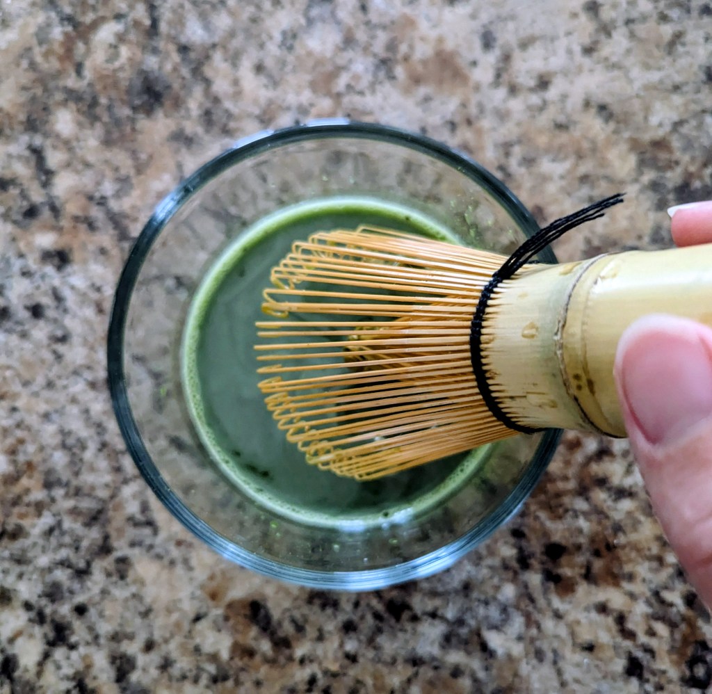 Adding lavender simple syrup to a lavender matcha 