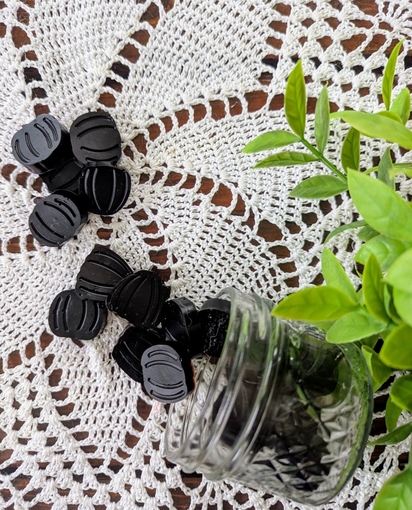Homemade elderberry gummies on a farmhouse table
