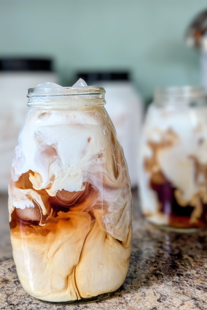 iced London fog recipe with swirled half-and-half in a glass jar