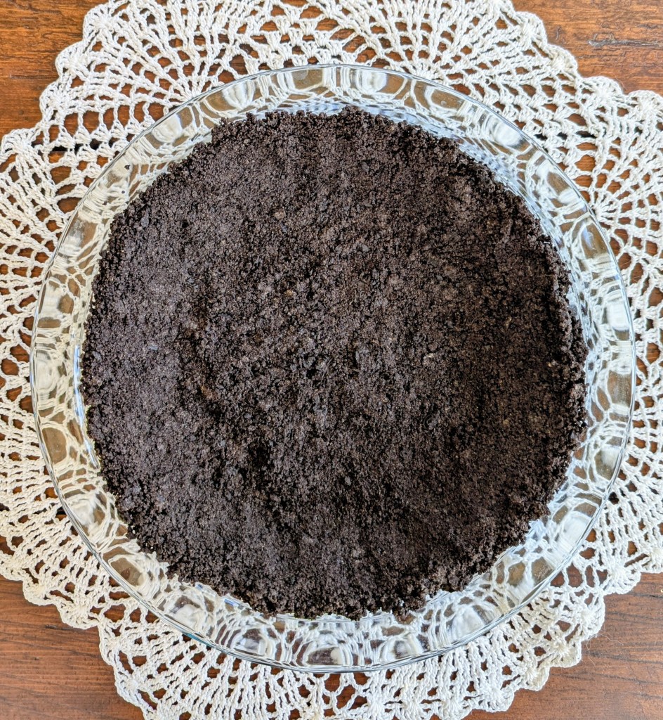 Freshly baked oreo pie crust recipe on a farmhouse table