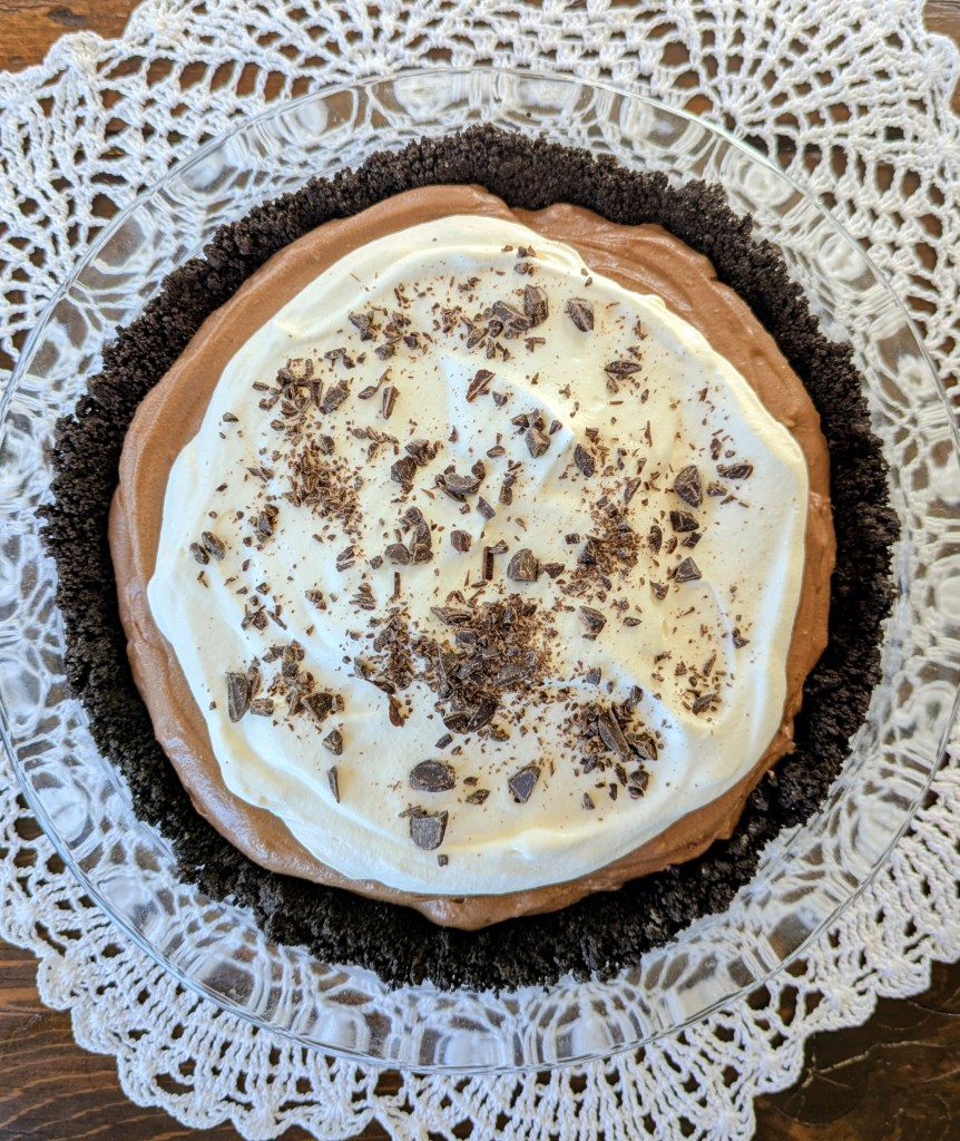 Aerial shot of chocolate French silk pie with whipped cream