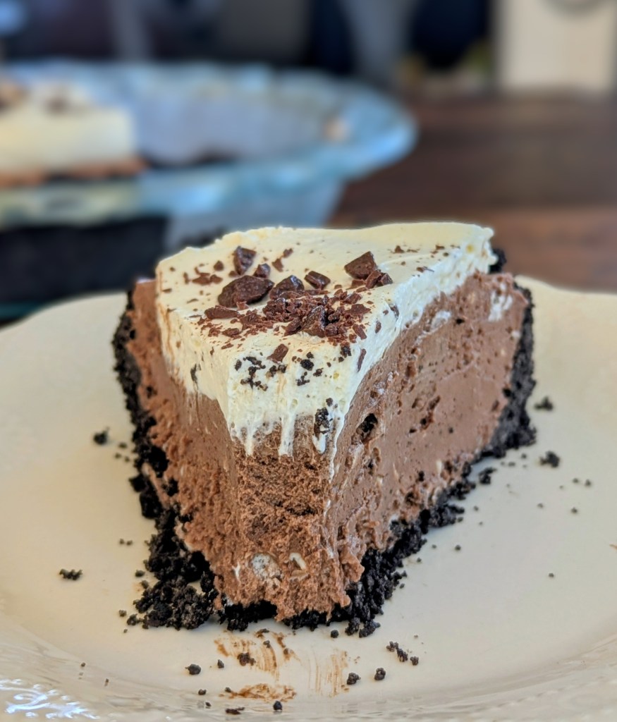 Sliceo of chocolate silk pie with whipped cream