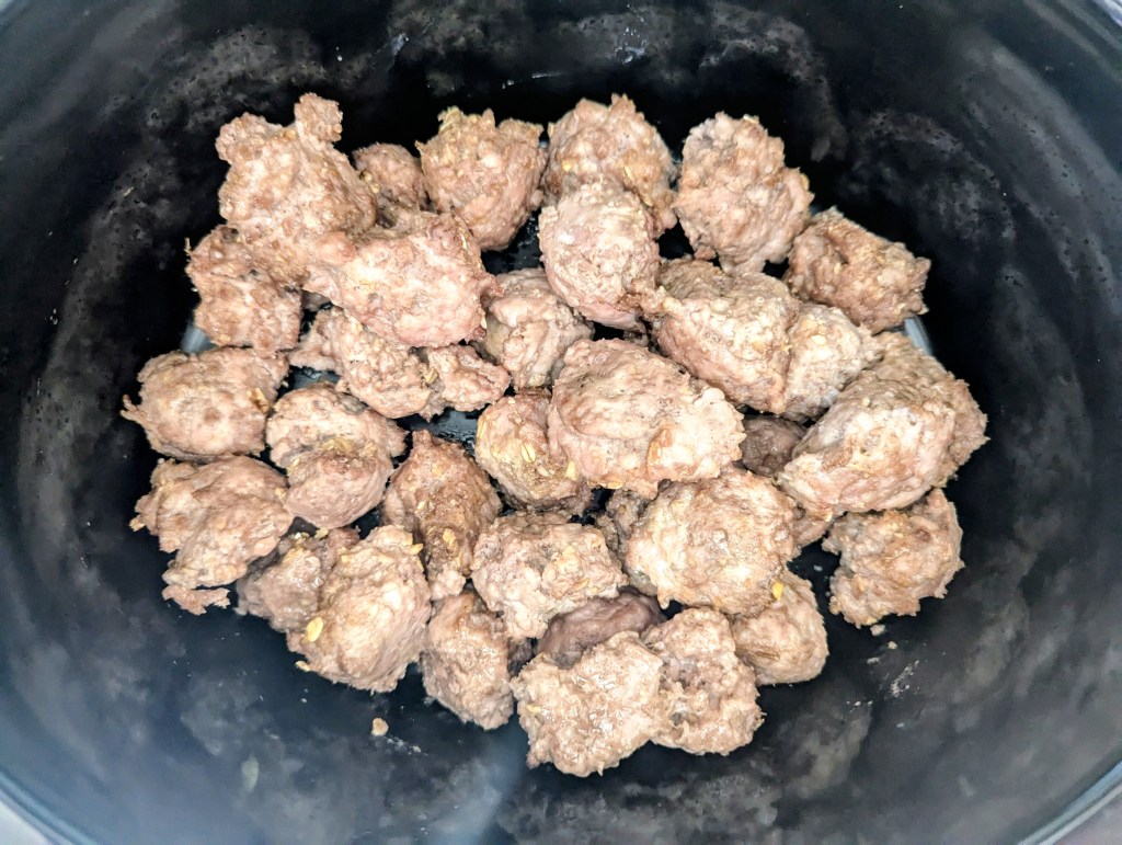 Browned swedish meatballs in a crocpot before cooking