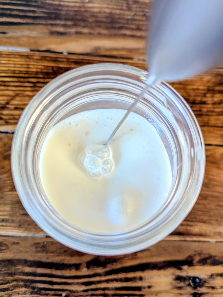 Aerial shot of frothing half and half for cold foam