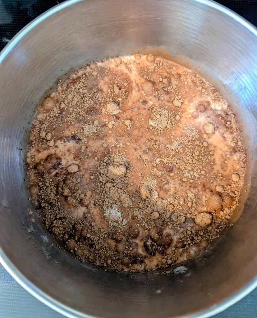 Warming ingredients for bone broth hot chocolate in a saucepan