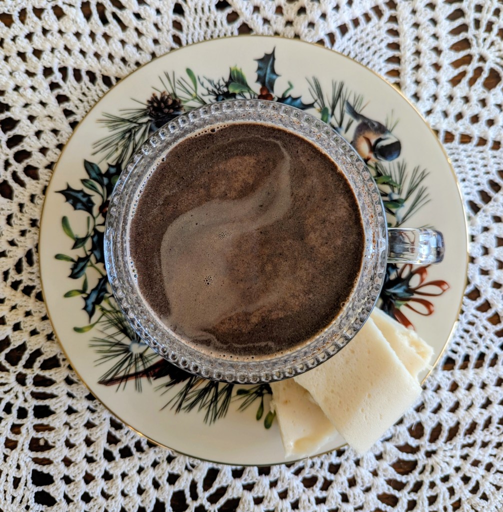 Aerial shot of bone broth hot chocolate in a glass mug