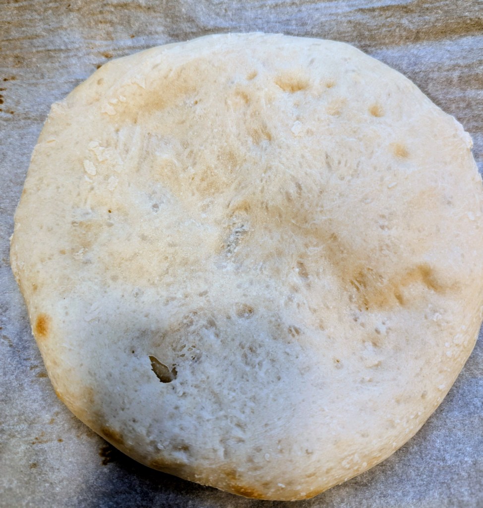 Aerial shot of golden parbaked sourdough pizza crust