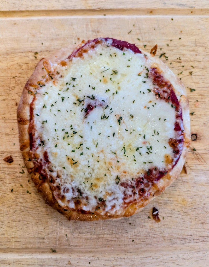 Aerial shot of golden sourdough pizza dough recipe with cheese