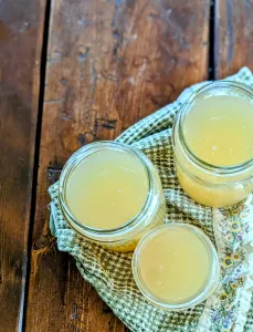 homemade bone broth on a farmhouse table