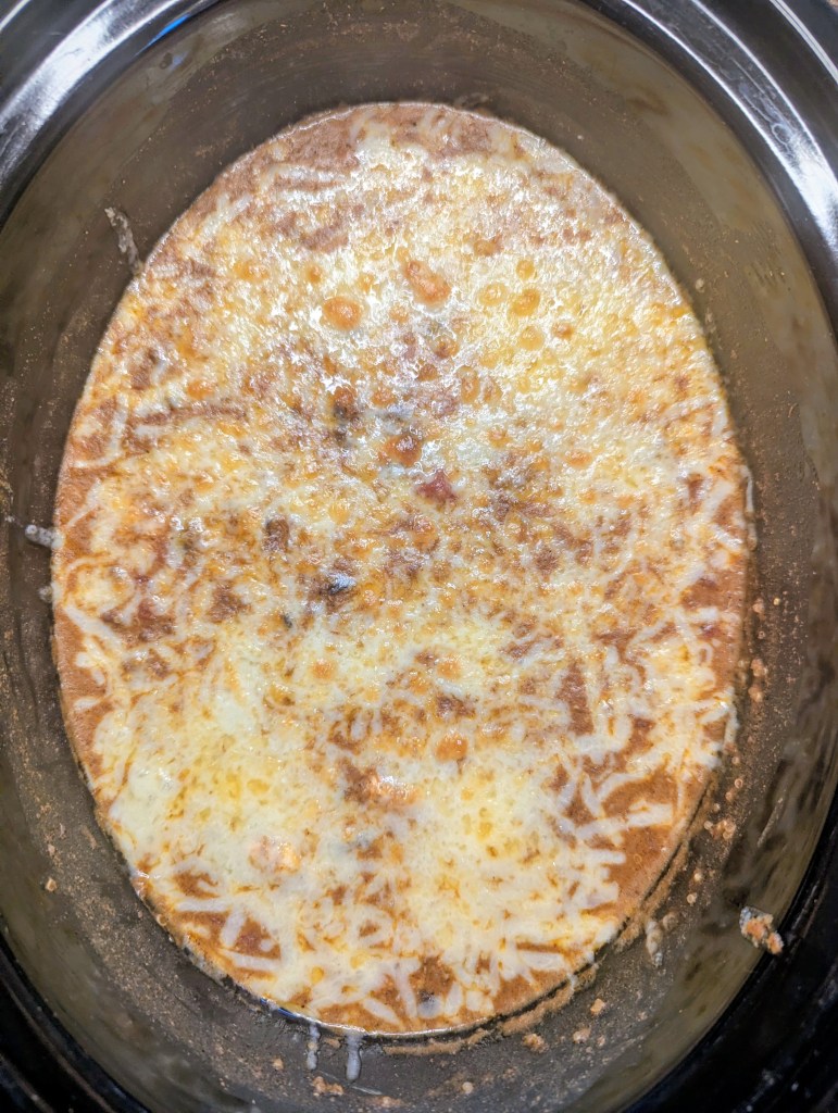 Quinoa enchilada casserole with melted cheese