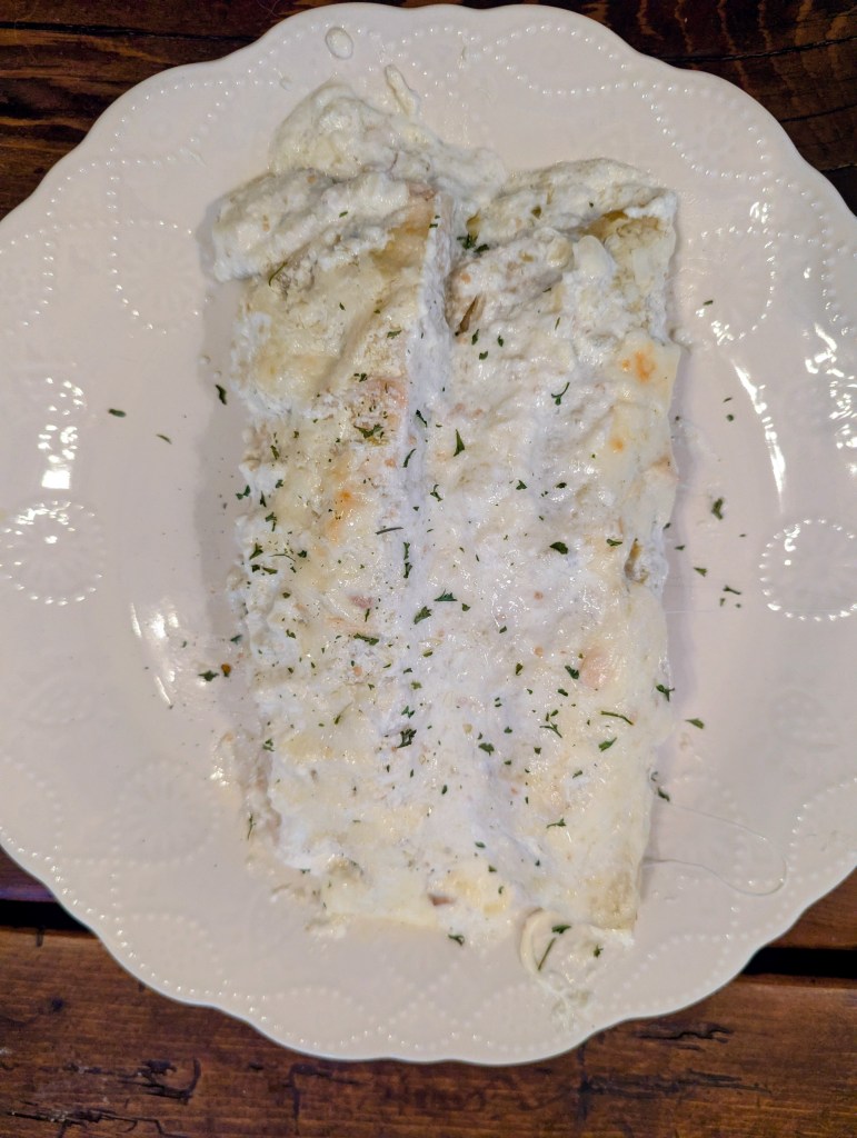 Aerial shot of plated chicken enchiladas verdes