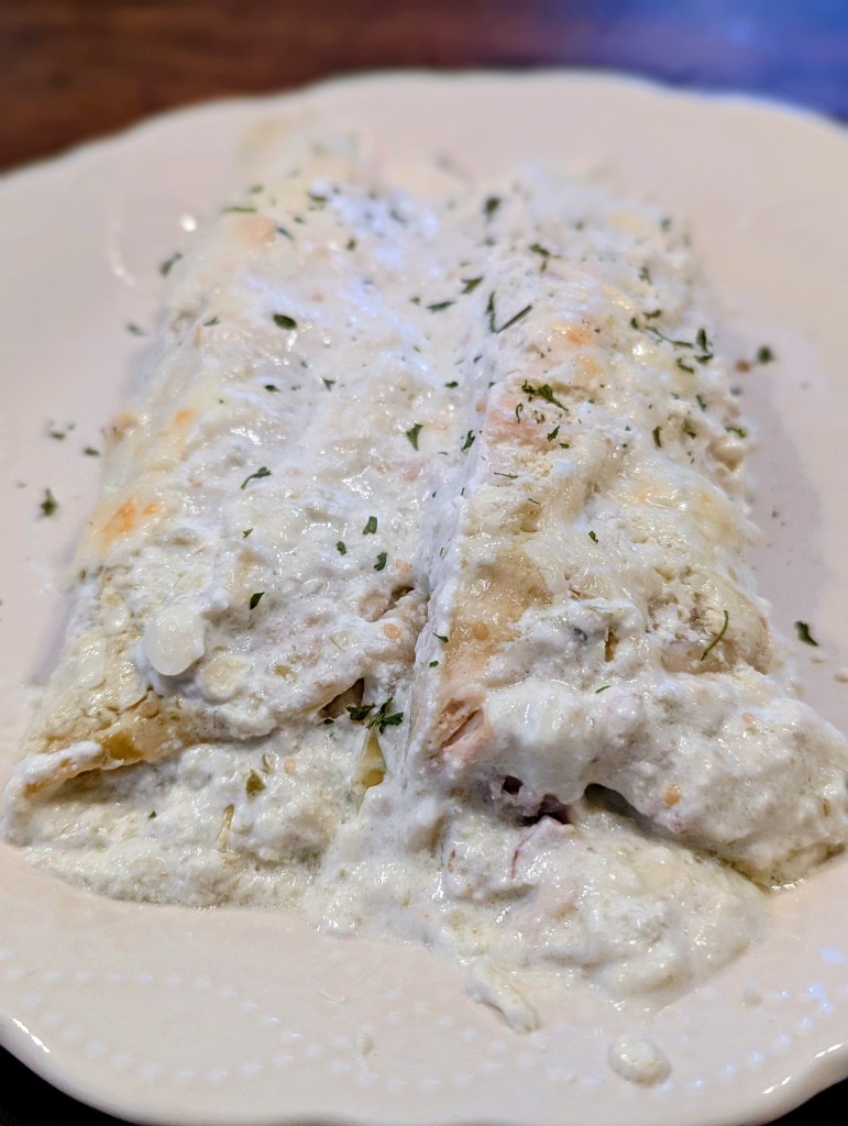 Plated chicken enchiladas verde