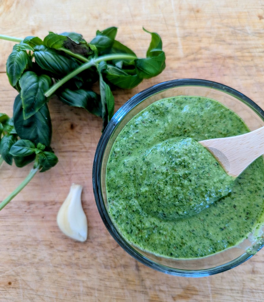 pesto recipe with walnuts on a wooden board