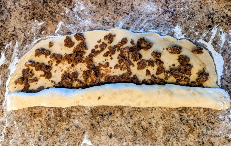 Rolling sourdough discard cinnamon rolls