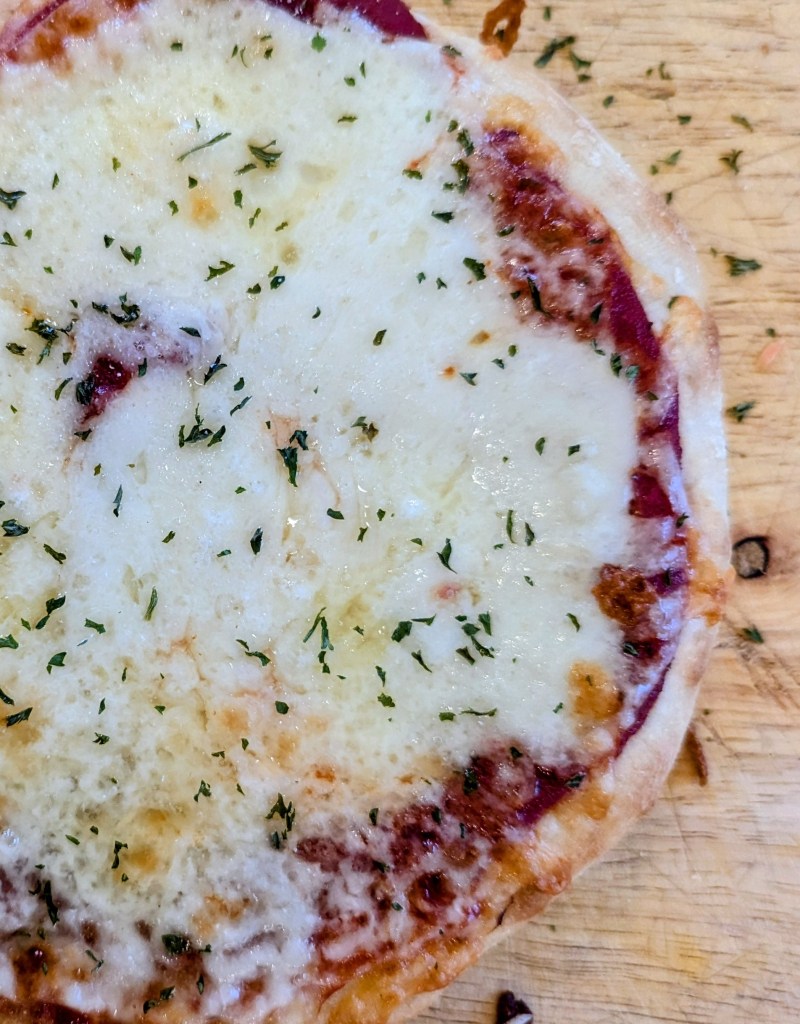 sourdough discard pizza dough with melted cheese