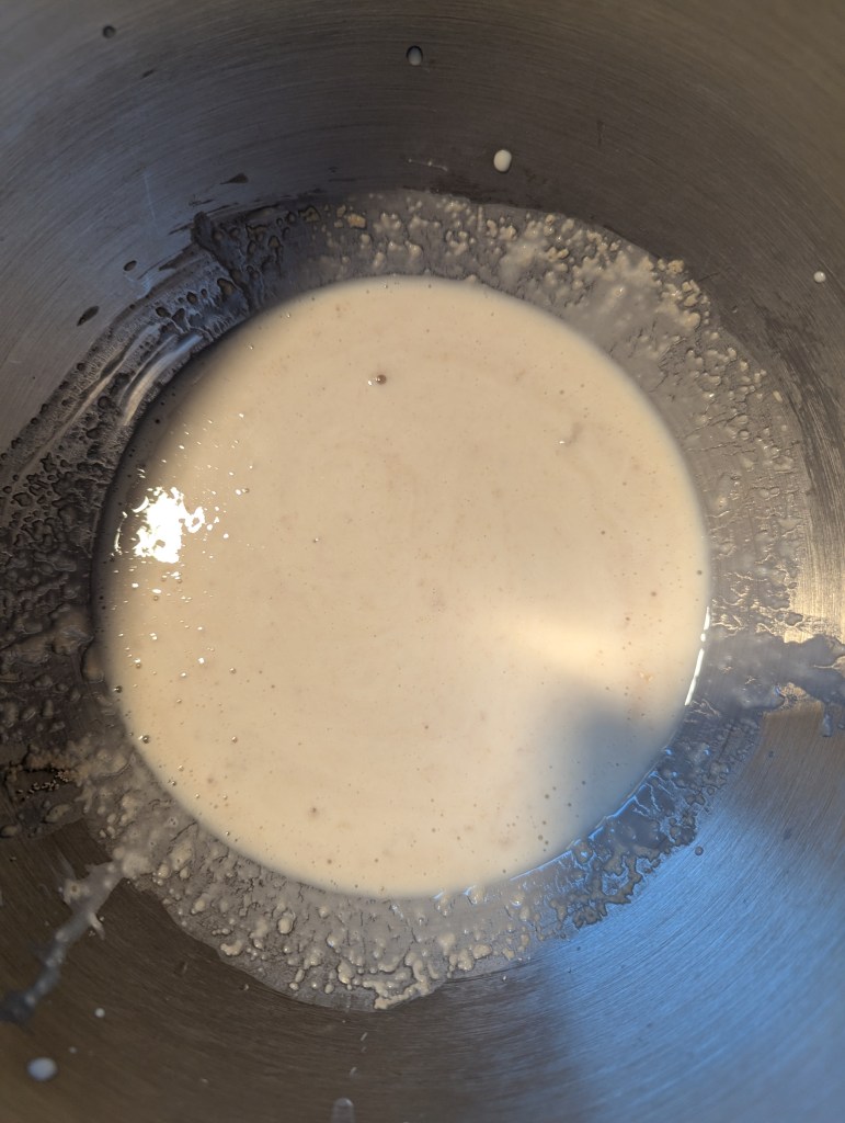 Mixing sourdough discard and yeast for sourdough discard cinnamon rolls