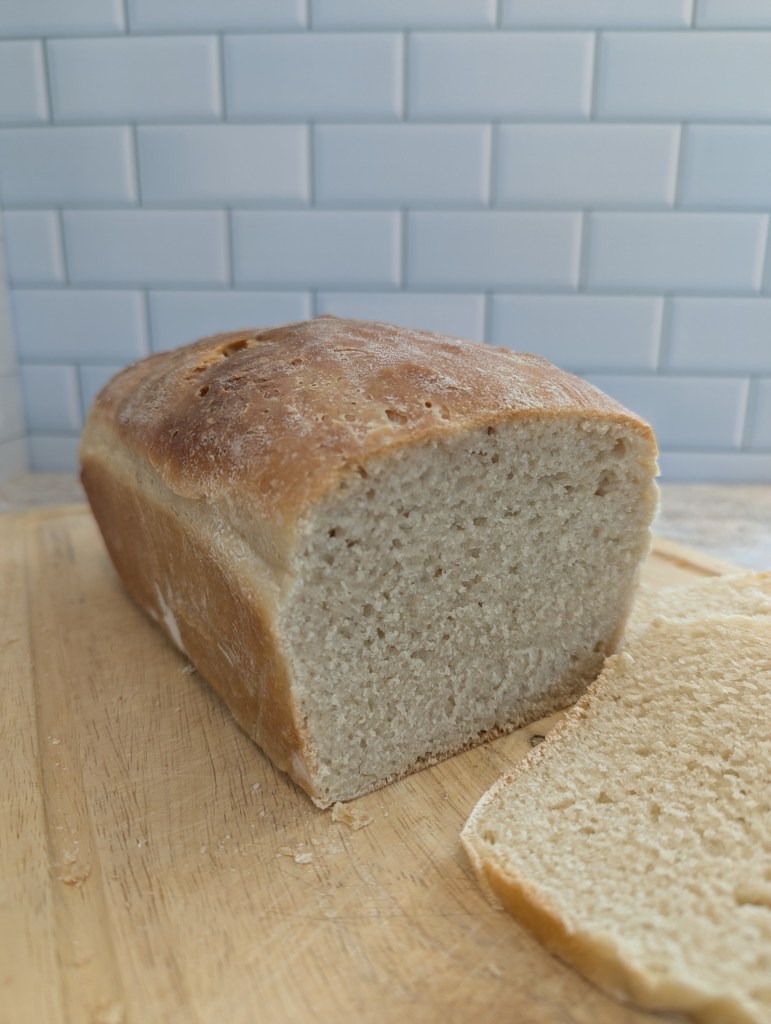 Sourdough sandwich bread on a wooden cutting board