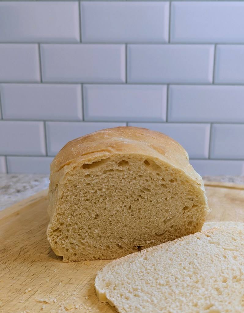Sliced sourdough discard sandwich bread on a cutting board

