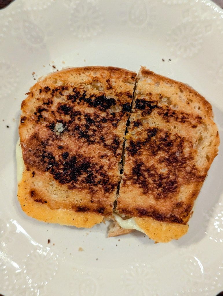 Aerial shot of sourdough grilled cheese on a plate