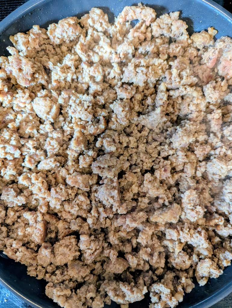 Browning sausage for dip with sausage, rotel, and cream cheese