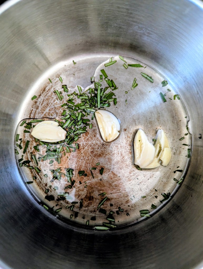 Infusing olive oil with garlic and rosemary for sourdough discard focaccia