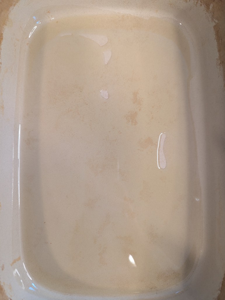 Preparing a pan for sourdough discard focaccia