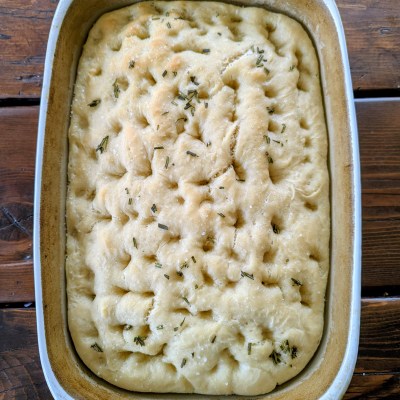 Aerial shot of sourdough discard focaccia on a farmhouse table