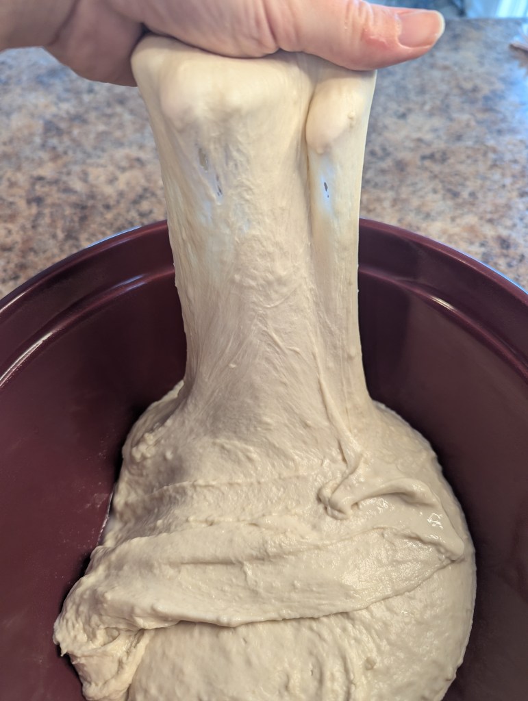 Performing stretch and folds for sourdough baguette recipe