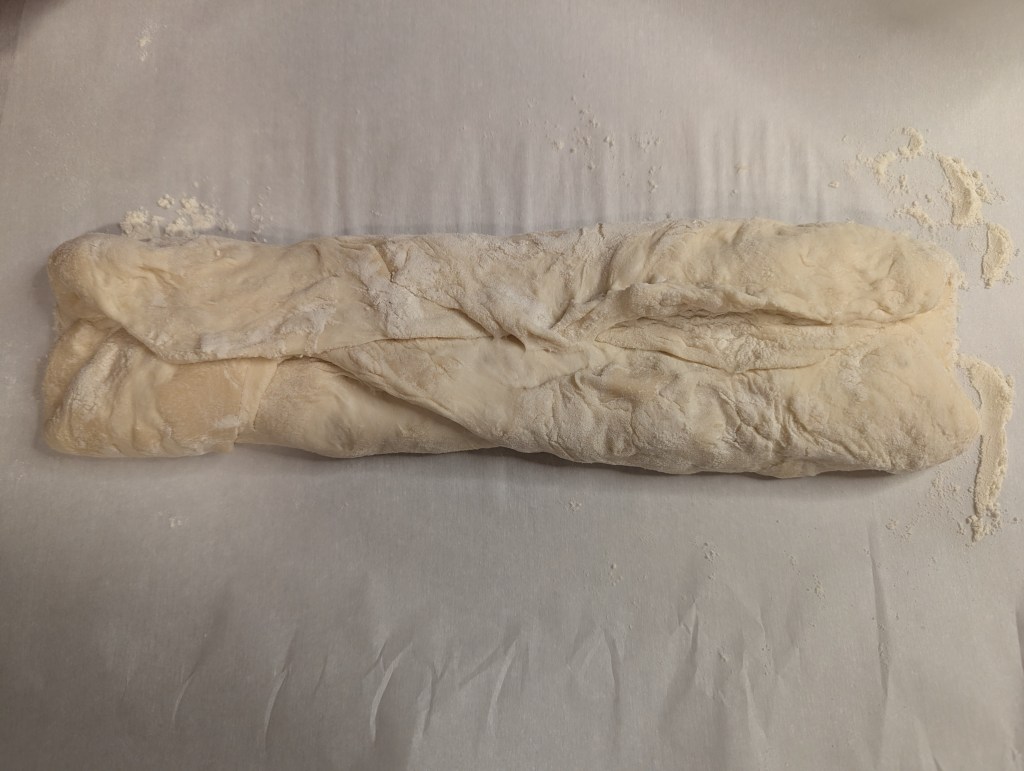 Aerial shot of shaping sourdough baguette dough