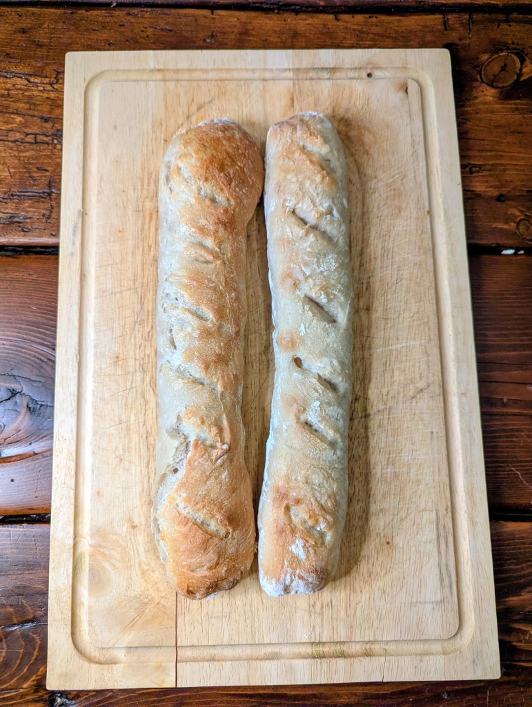Sourdough baguette recipe on a farmhouse table