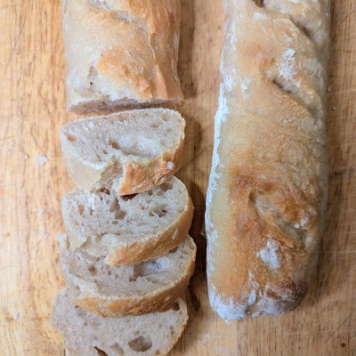 Sliced sourdough baguette recipe on cutting board