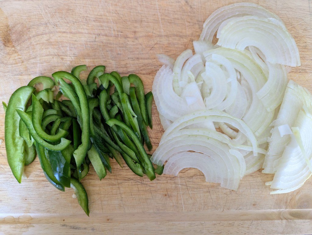 Aerial shot of peppers and onions for Philly cheesesteak recipe