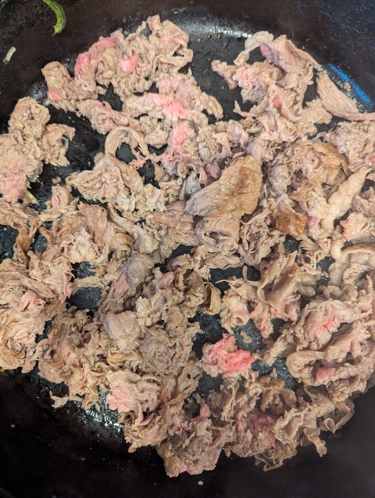 Sauteing beef for Philly cheesesteaks
