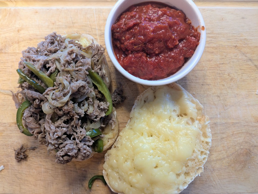 Aerial shot of elements of a Philly cheesesteak recipe