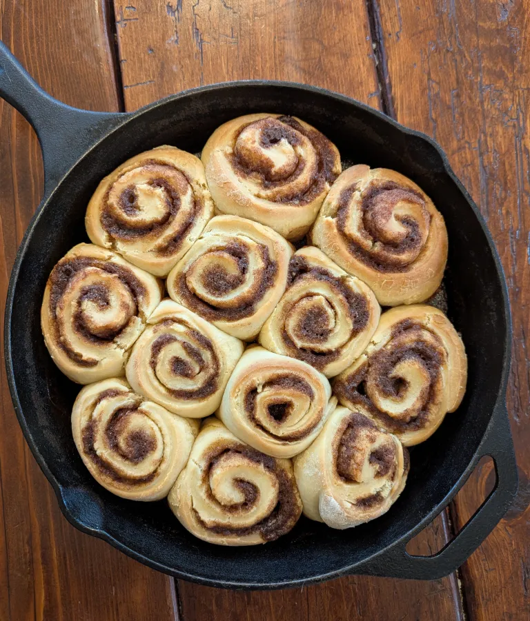 Sourdough cinnaon rolls in a cast-iron skillet