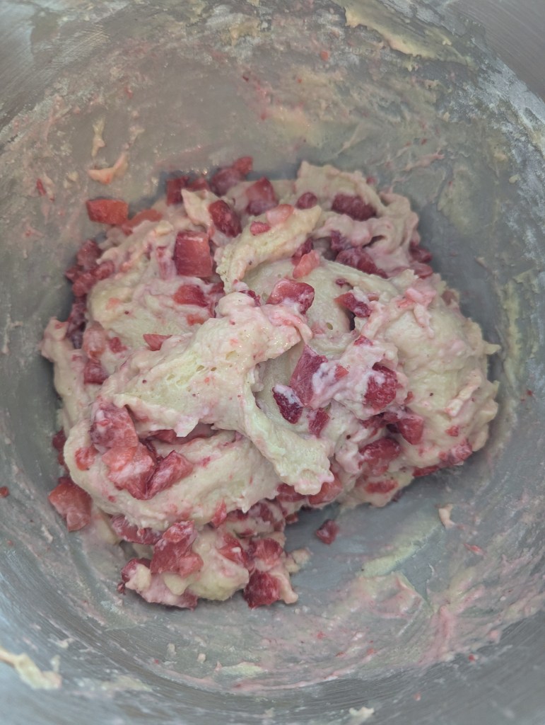 Folding strawberries into strawberry sourdough bread