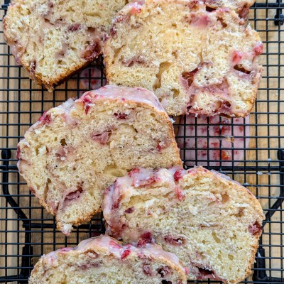 Sliced strawberry sourdough bread on a wire rack