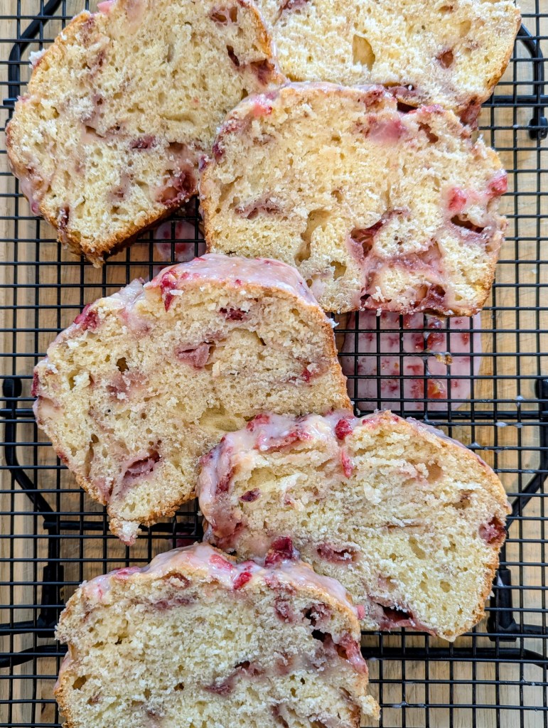 Slices of strawberry sourdough bread on a wire rack