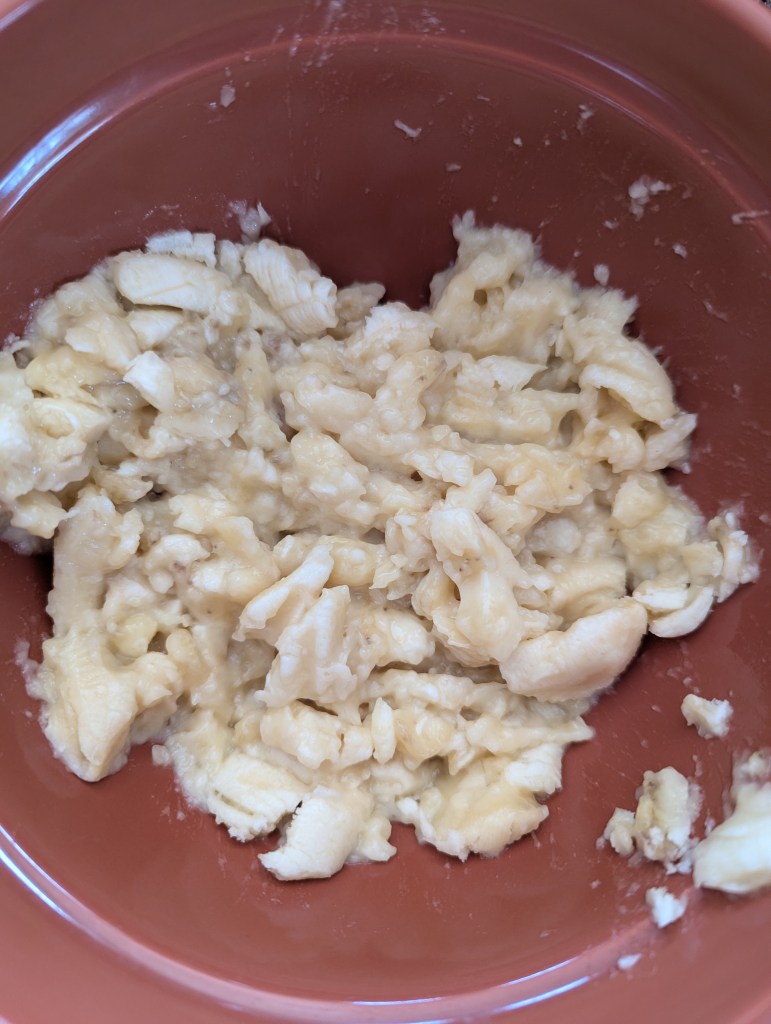 Mashing bananas for gluten free chocolate banana bread