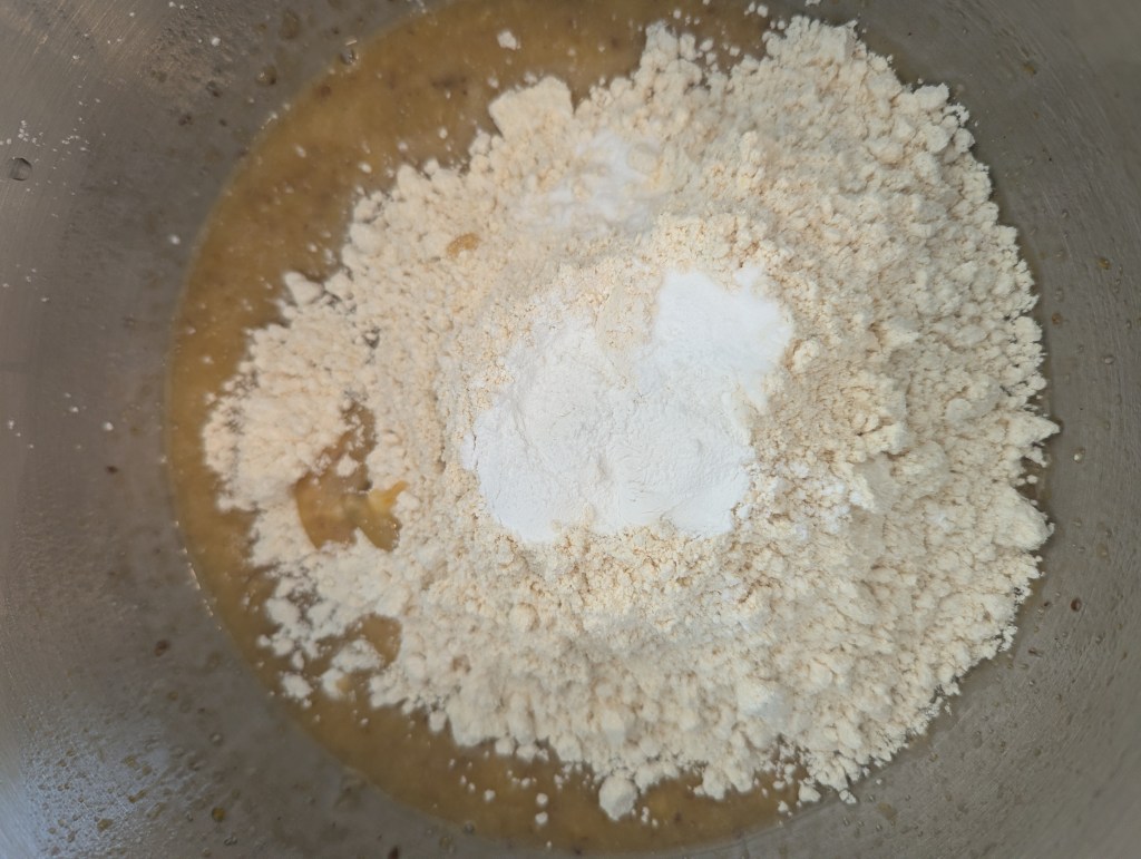 Adding dry ingredients to gluten-free chocolate chip banana bread