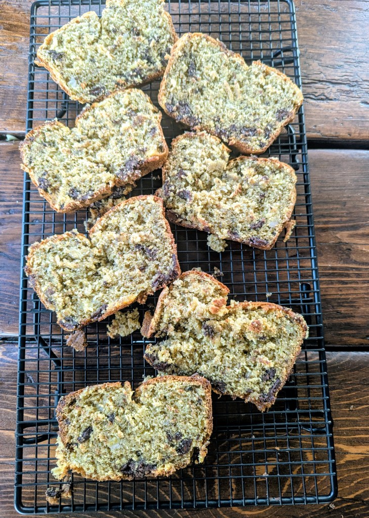 Slices of gluten free chocolate chip banana bread on a wire rack