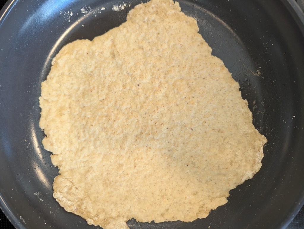 Gluten free tortillas cooking in a skillet
